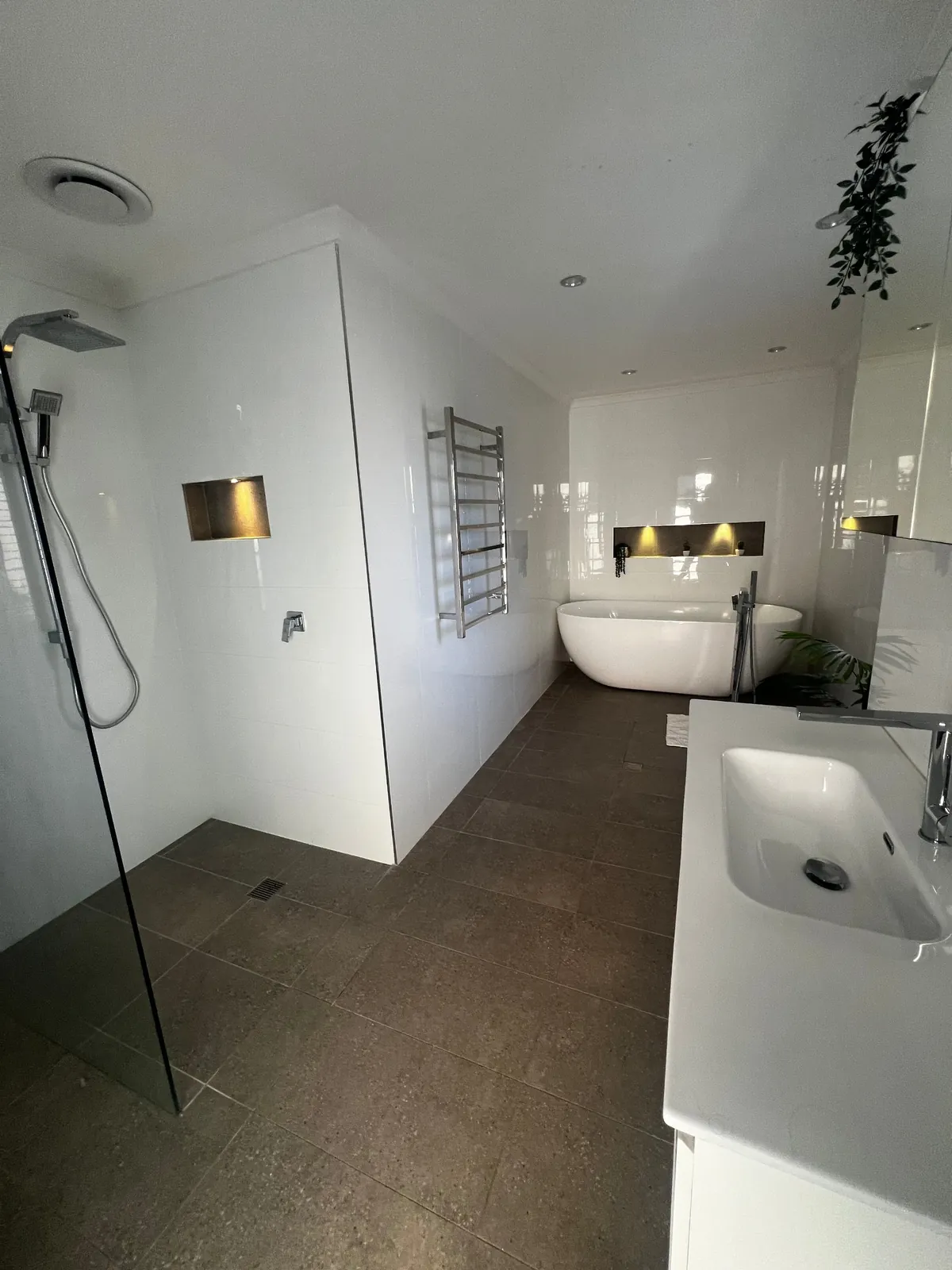 Bathroom renovation, freestanding bath and lit niche