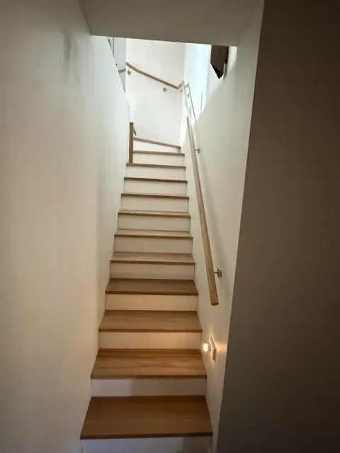 Staircase with timber treads and handrail