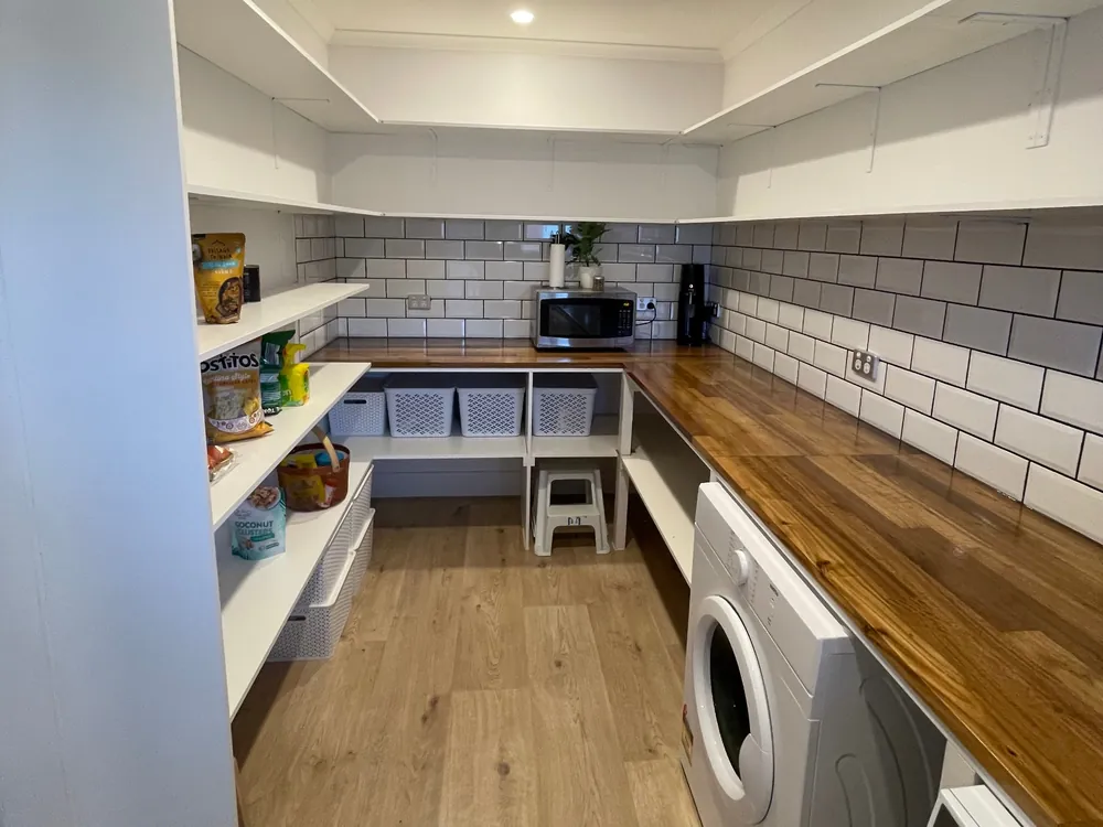 Renovated pantry with timber benchtop and subway tile, Oakleaf Construction